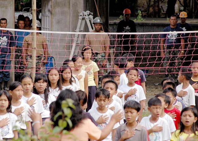 Filipino elementary school students lined up at the start of a school day
