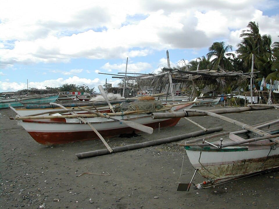 Fishing pumpboats docked on a beach in the Philippines