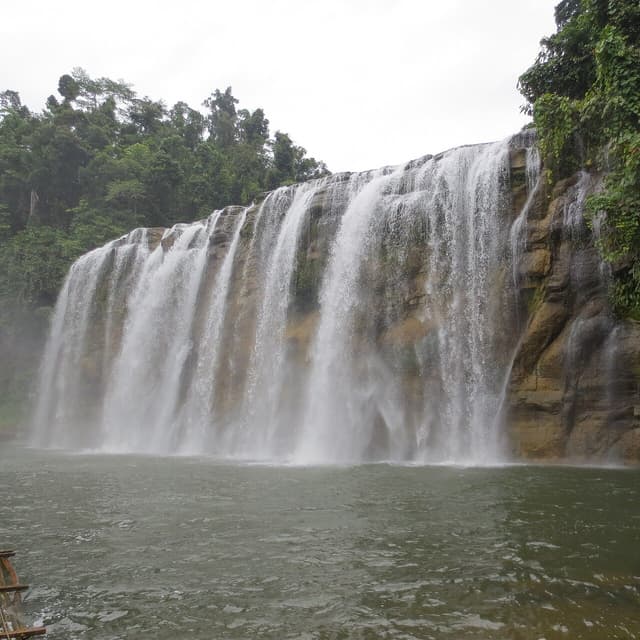 Tinuy-an Falls seen from its second tier, surrounded by forest