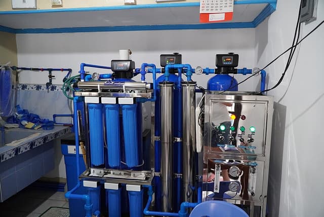 Filtration and purification equipment inside a water refilling station in Lobo, Batangas, illustrating the kind of treatment system a bulk water facility would use