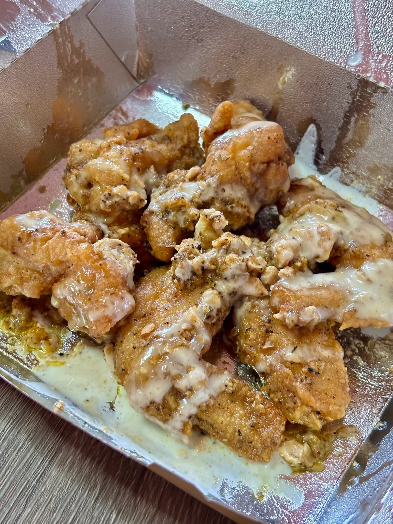 A serving of sauced chicken wings from Kitchenero