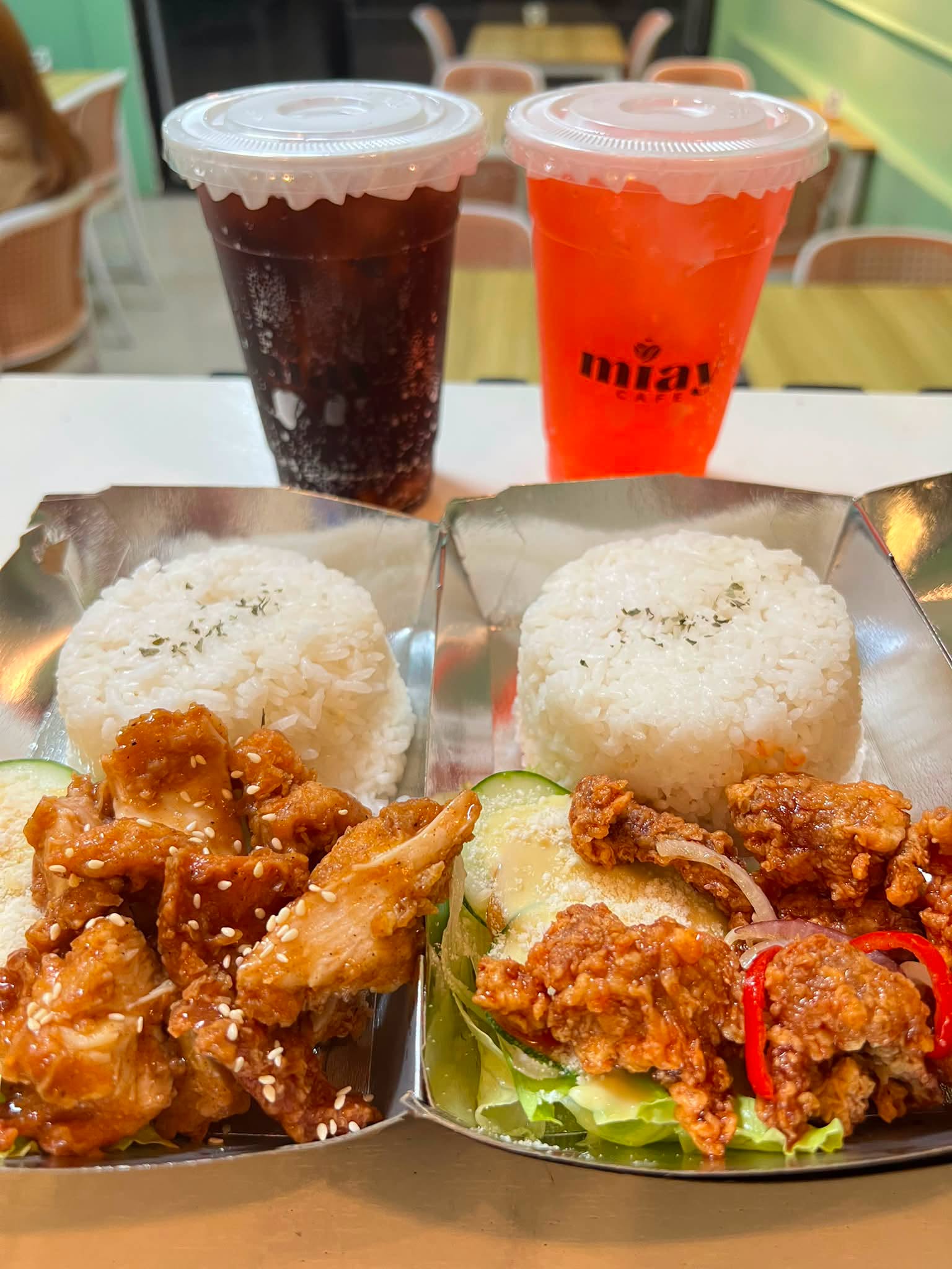 Iced drinks in branded cups and a rice meal from Miay Cafe